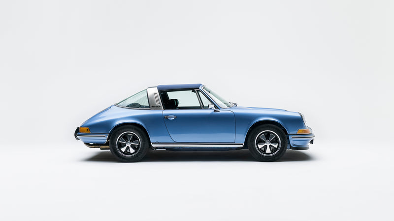 Side view of a Blue Triebwerk F3.8 Targa on a white background