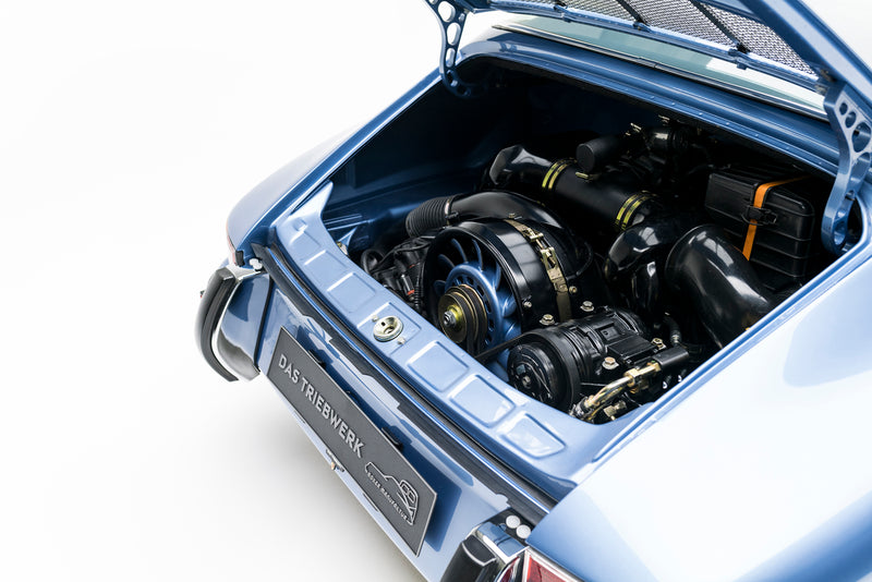 Engine compartment of Blue Triebwerk F3.8 Targa with visible branding on a white background